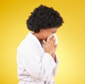 Sick black woman, tissue and blowing nose with afro and morning gown against a studio background. Isolated African Royalty Free Stock Photo