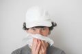 A Sick Boy Blowing His Nose with Kleenex Tissue Royalty Free Stock Photo