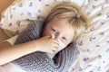 Sick boy blowing nose Royalty Free Stock Photo