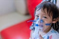 Sick boy inhalation therapy by the mask of inhaler. Baby has asthma and need nebulizations. Patient Boy use inhalation with Nebuli Royalty Free Stock Photo