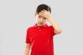 Sick boy in red t-shirt suffering from headache Royalty Free Stock Photo