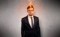 Sick businessman with burning head concept