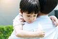 Sick child get sad and depressed His father holding adorable boy or son for encouraging him Unhappy kid missing his mother and Royalty Free Stock Photo