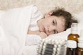Sick child girl in a bed Royalty Free Stock Photo