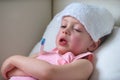 Sick child with high fever laying in bed Royalty Free Stock Photo