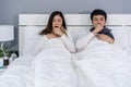 Sick couple coughing and suffering from virus disease and fever on bed Royalty Free Stock Photo