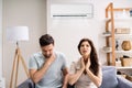 Sick Couple Having Cold From Air Conditioner