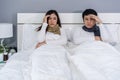 Sick couple headache and suffering from virus disease and fever on bed Royalty Free Stock Photo