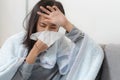 Sick day at home. Asian woman has runny and common cold Royalty Free Stock Photo