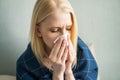 Sick day at home. woman has runny and common cold. Royalty Free Stock Photo