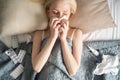 Sick day at home. woman has runny and common cold. Royalty Free Stock Photo