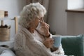 Sick elderly 60s lady suffering from cold or flu Royalty Free Stock Photo