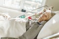 Sick, elderly senior woman in a hospital bed Royalty Free Stock Photo