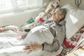 Sick, elderly senior woman in a hospital bed Royalty Free Stock Photo