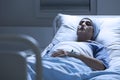 Woman alone in hospital bed Royalty Free Stock Photo