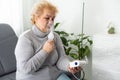 Sick elderly woman making inhalation Royalty Free Stock Photo