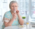 Sick elderly woman making inhalation Royalty Free Stock Photo