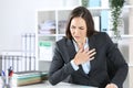 Sick executive suffocating holding chest at office