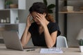 Unwell young woman suffer from headache working on laptop Royalty Free Stock Photo