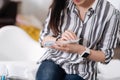 Sick female holding organizer for medicine