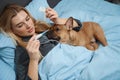 Ill woman measuring her body temperature in bedroom Royalty Free Stock Photo