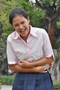 Sick Filipina Teenage Female Wearing Pink Shirt In Park