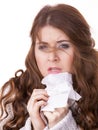 Sick freezing woman sneezing in tissue