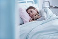 Sick girl in hospital bed