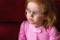 Sick Girl With Very Thick Glasses and Magnified Blue Eyes Royalty Free Stock Photo