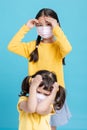 Sick Girls in medical mask isolated on blue background