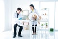 Sick Golden Retriever dog in the veterinary clinic. The vet is happily working with the team in the examination room that has a Royalty Free Stock Photo