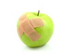 Sick green apple with patches Royalty Free Stock Photo