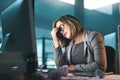 Sick, headache and business woman in office, tired or fatigue while working late at night on computer. Burnout, migraine Royalty Free Stock Photo