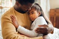 Sick, illness and father with his child with pain, sad or problem in her bedroom at their home. Ill, care and African