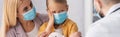 Sick kid in medical mask looking