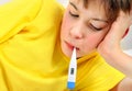 Sick Kid with Thermometer Royalty Free Stock Photo