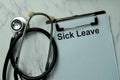 Sick Leave write on a paperwork isolated on office desk Royalty Free Stock Photo
