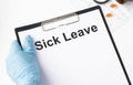 Sick Leave write on a paperwork isolated Royalty Free Stock Photo