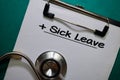 Sick Leave write on a paperwork isolated on Office Desk