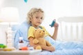 Sick little boy with asthma medicine. Ill child Royalty Free Stock Photo