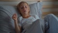 Sick little boy in a bed. Superslowmotion shot of a boy coughing in bed. Baby flu concept