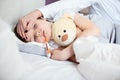 Sick little child with temperature in bed. Royalty Free Stock Photo