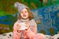 Sick little girl sneezing with handkerchief in hands, healthcare