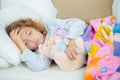 Sick little girl on sofa with fever Royalty Free Stock Photo