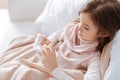 Sick little girl taking pills Royalty Free Stock Photo