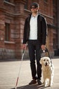 Sick man with blindness get help by dog guide Royalty Free Stock Photo
