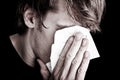 Sick man blowing nose Royalty Free Stock Photo