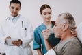 The Sick Man with Doctor and Nurse in Hospital