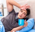 Sick man with flu lying in the bed Royalty Free Stock Photo