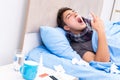 The sick man with flu lying in the bed Royalty Free Stock Photo